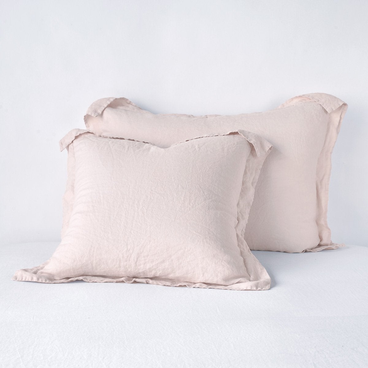 Pearl: Two shams leaning upright against a white background.