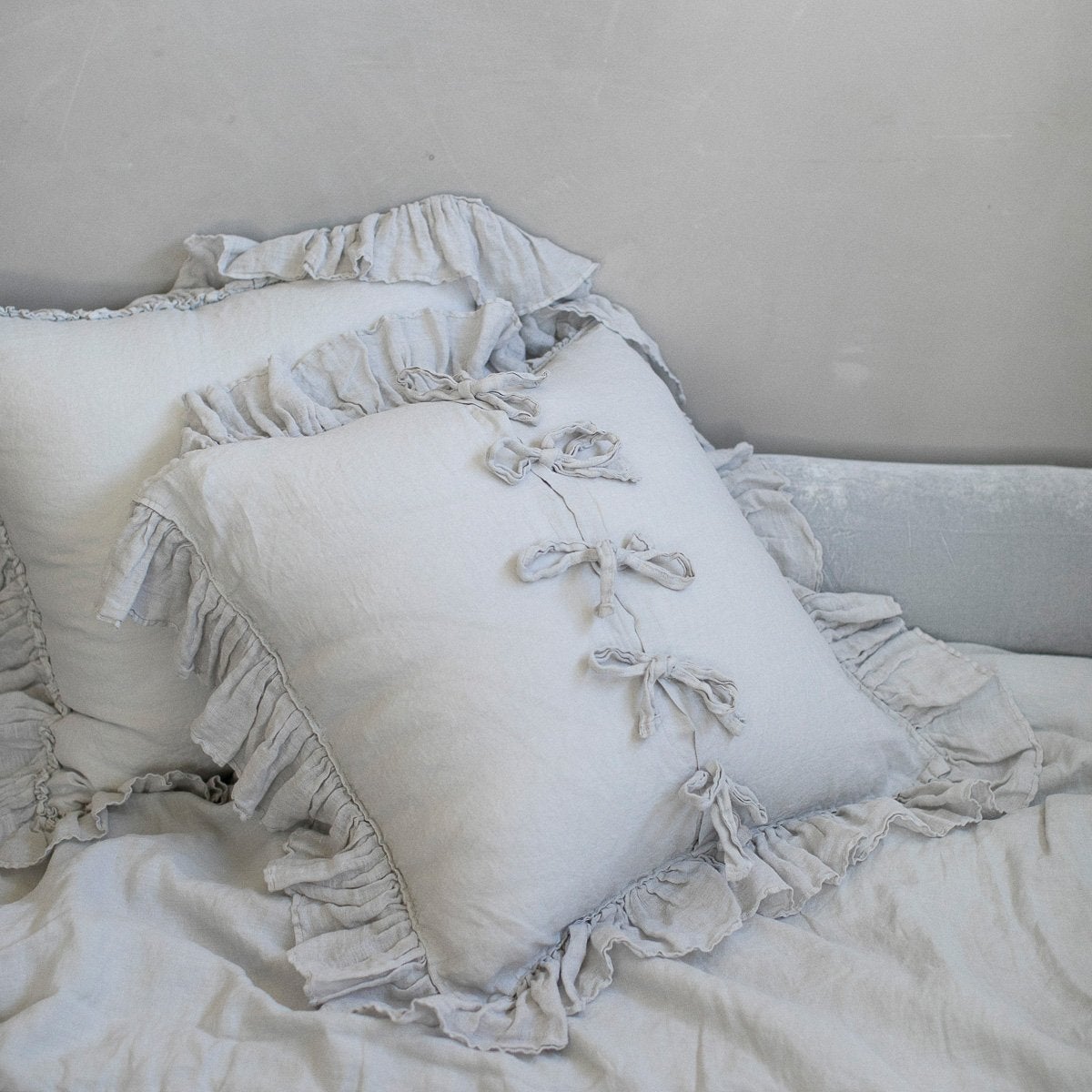 : Linen whisper sham leaning backwards to showcase tie closures - sterling.