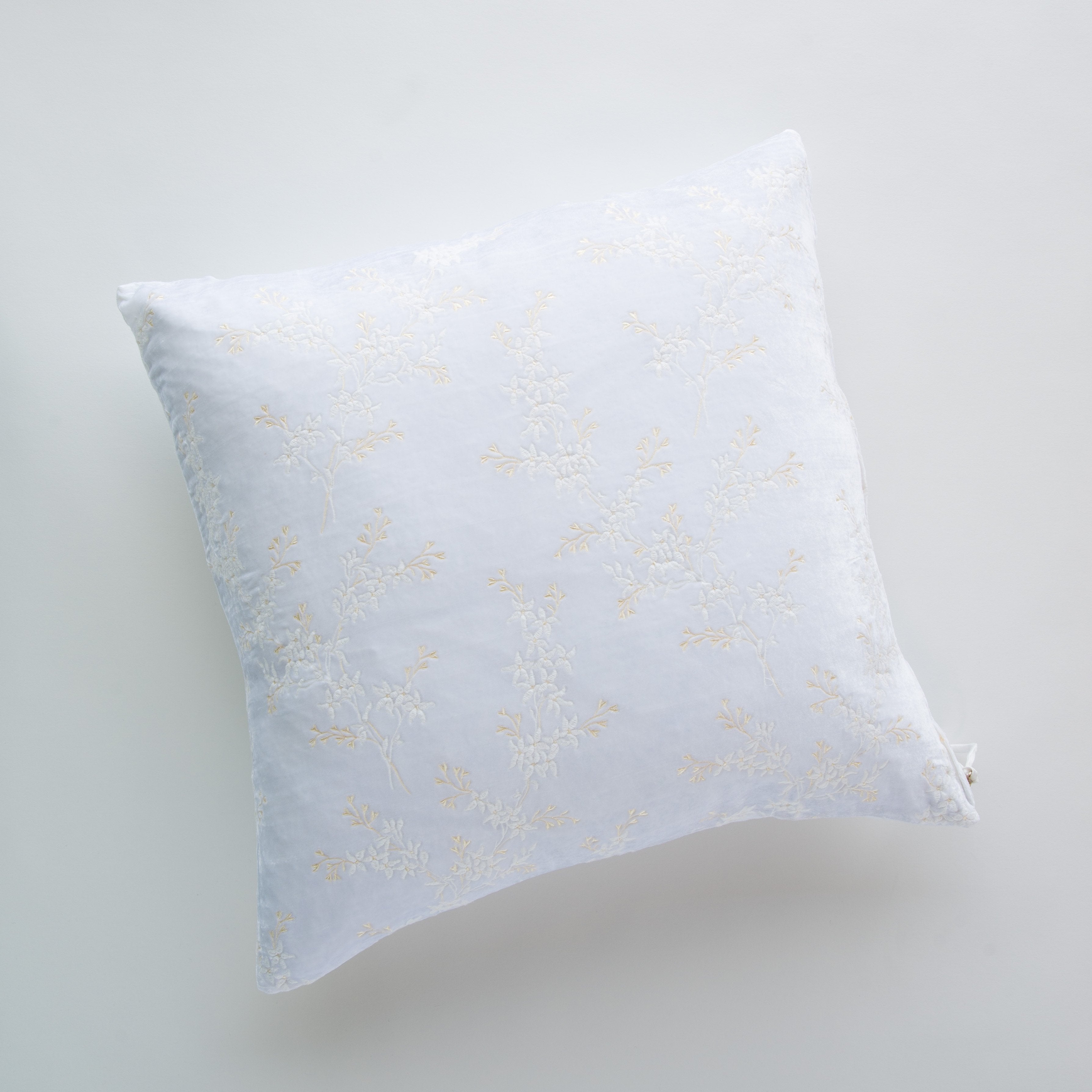 White: pillow against a plain background - overhead view.