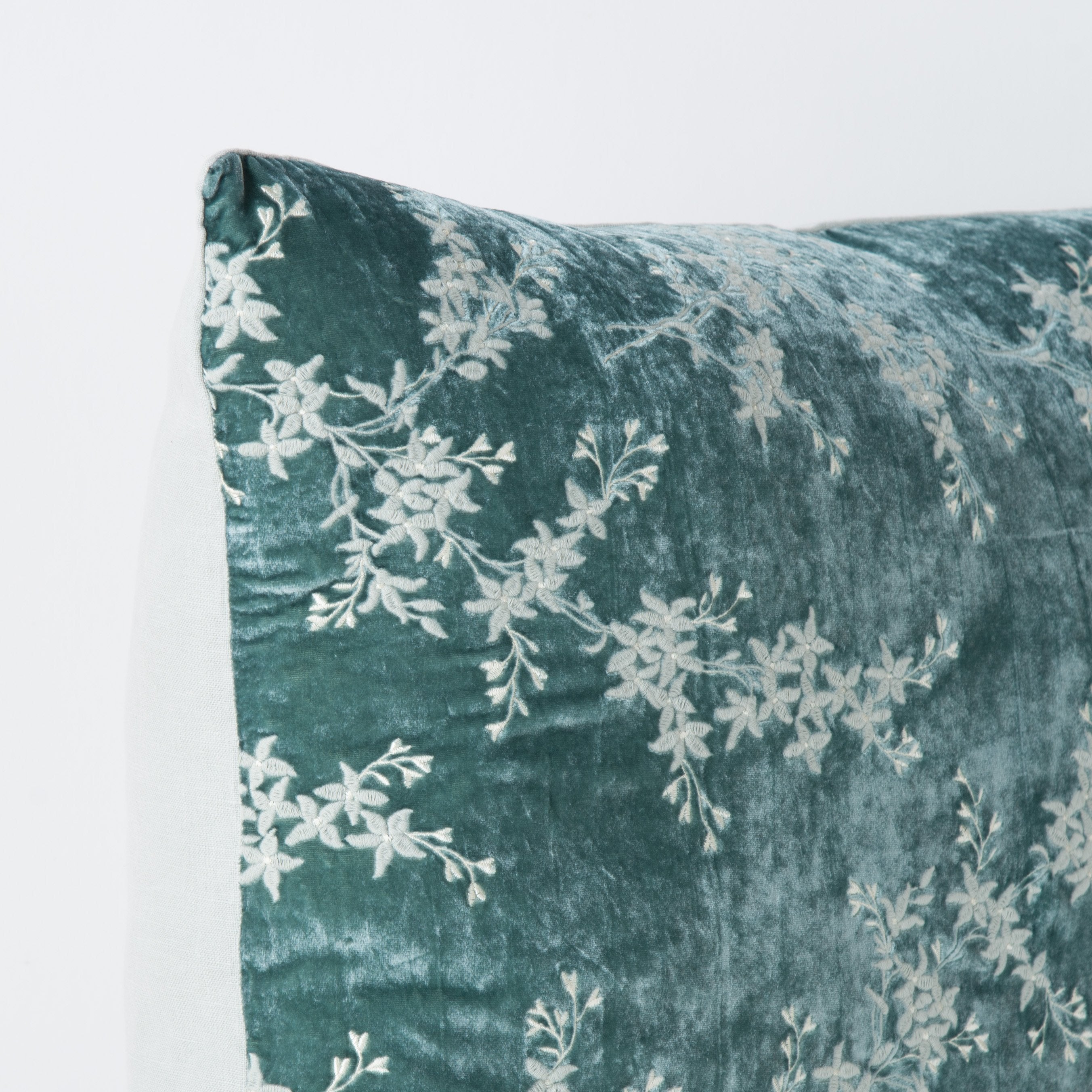 Eucalyptus: Corner detail close-up, highlighting two-tone embroidery and linen back.