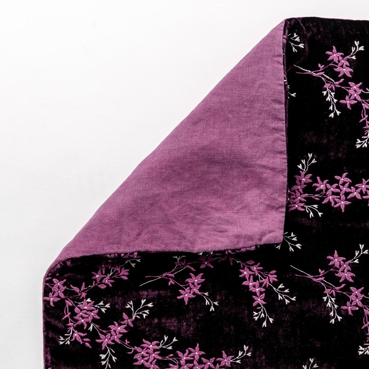 Fig: Close up of blanket, with a corner turned back to showcase the linen back - overhead view.