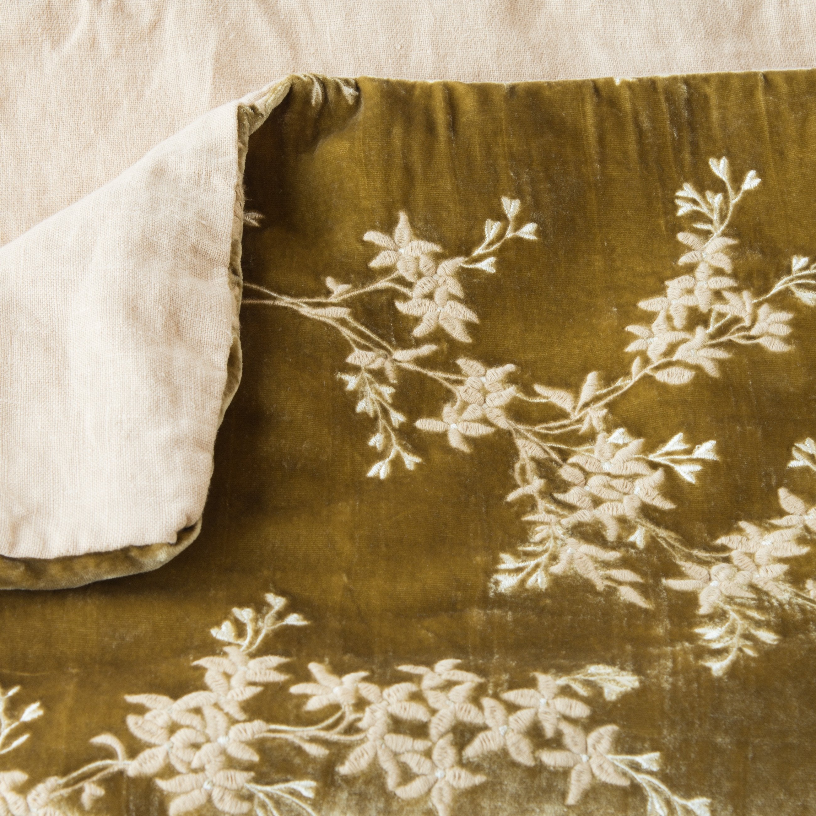 Honeycomb: Close up of blanket, with a corner turned back to showcase the linen back - overhead view.
