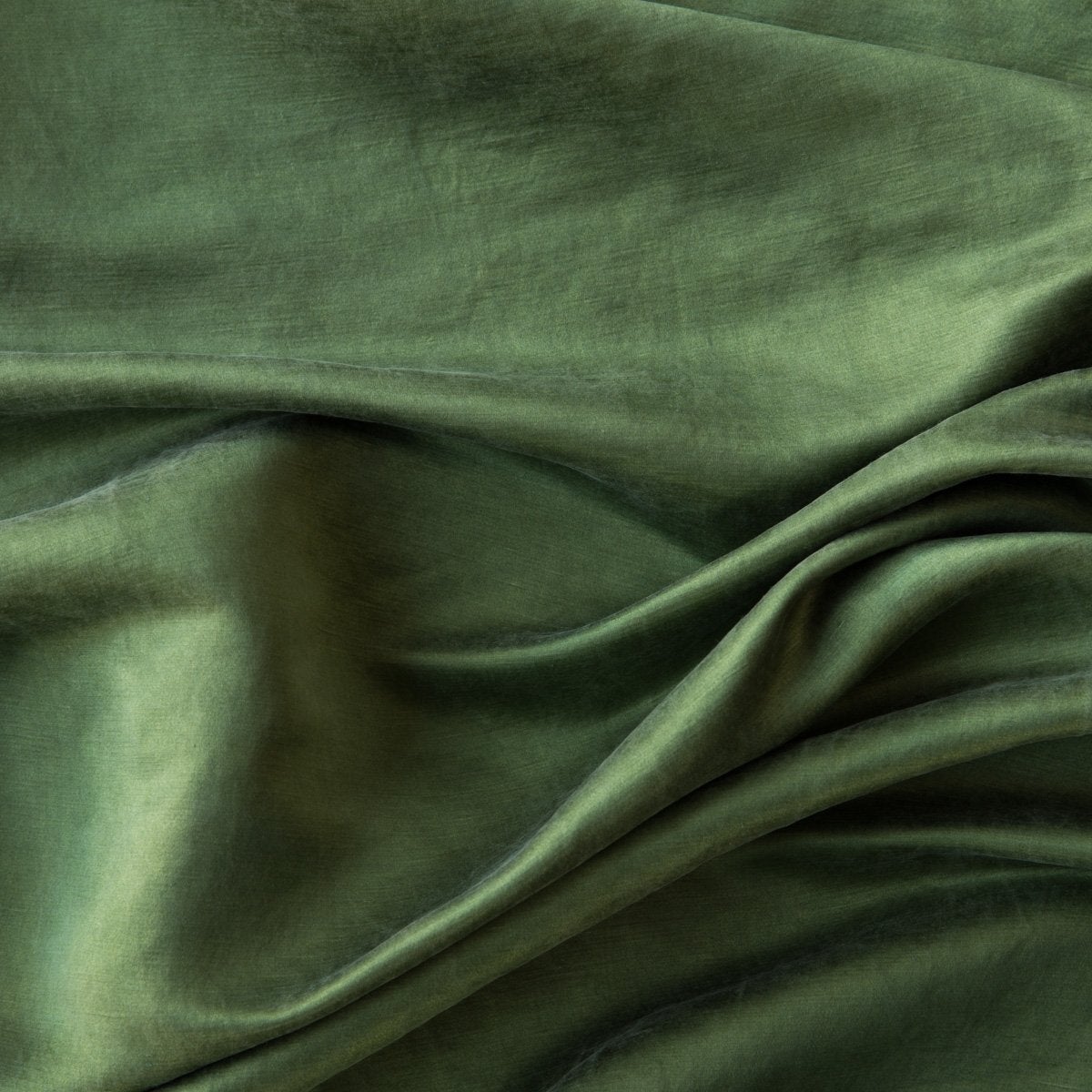 Jade: Close-up of silk charmeuse in jade, a rich, verdant green with subtle blue undertones. 