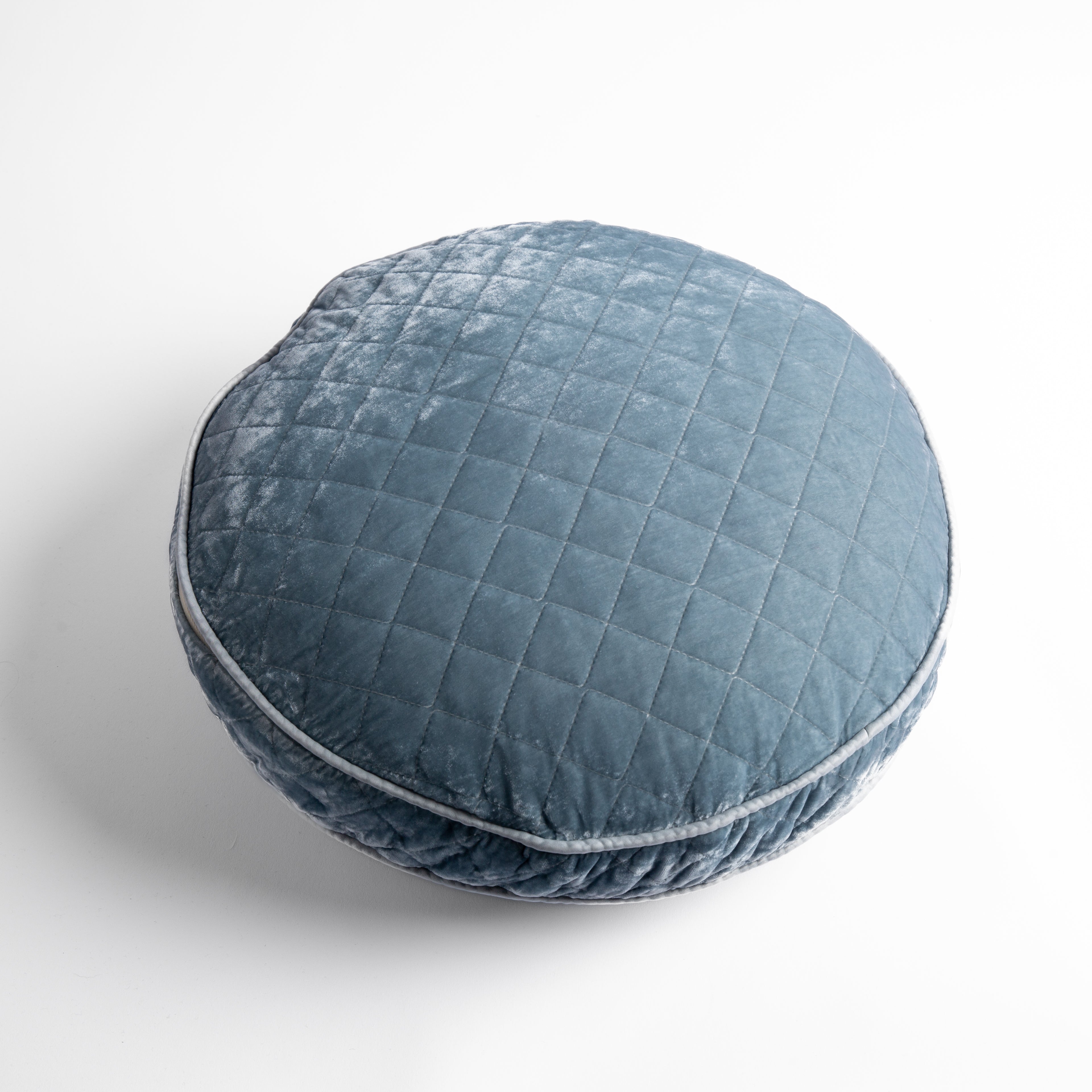 Cloud: overhead at a slight angle against a white background, the face and gusset of the pillow are visible.