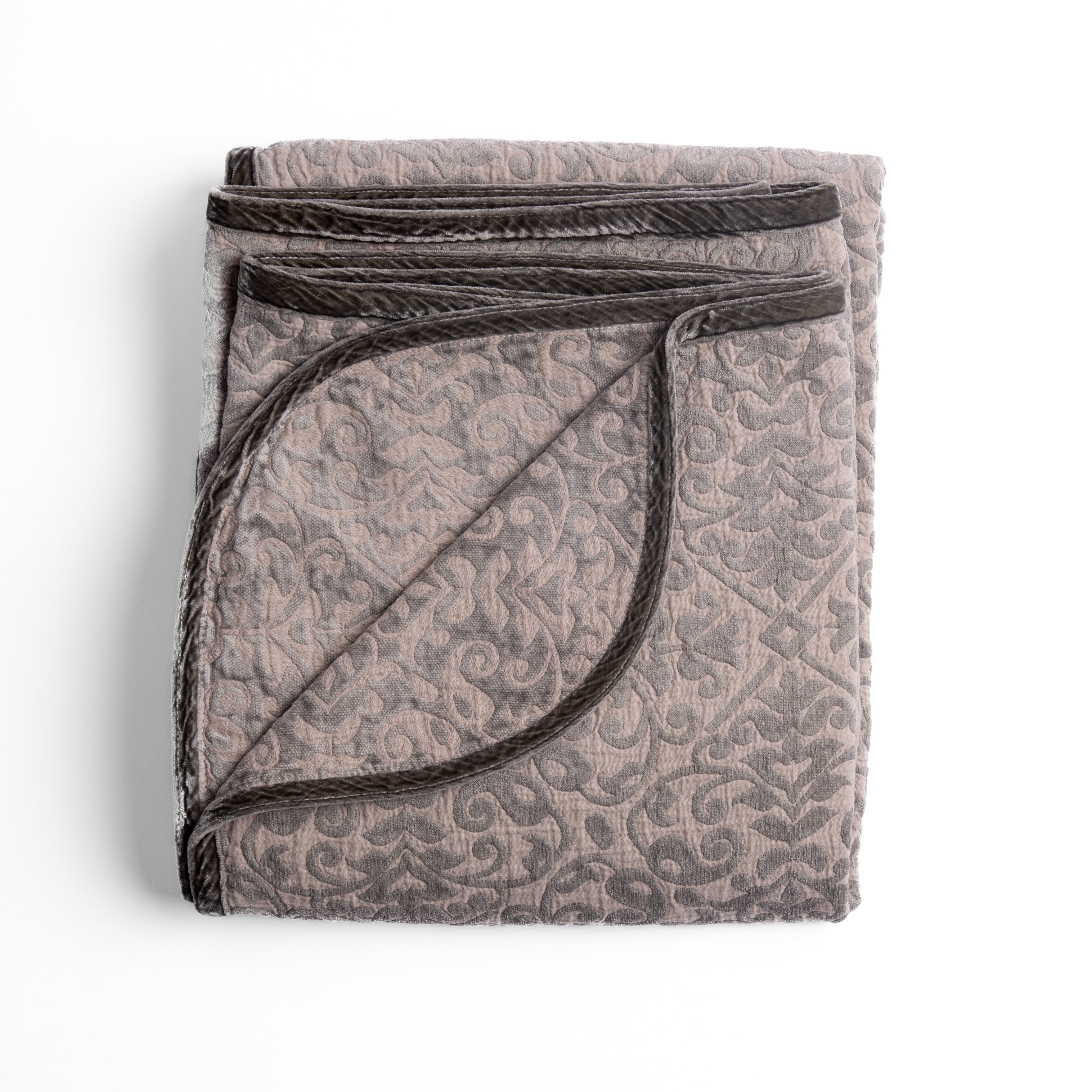 Fog: Folded cotton chenille jacquard blanket with corner folded back — overhead on a plain white background. 