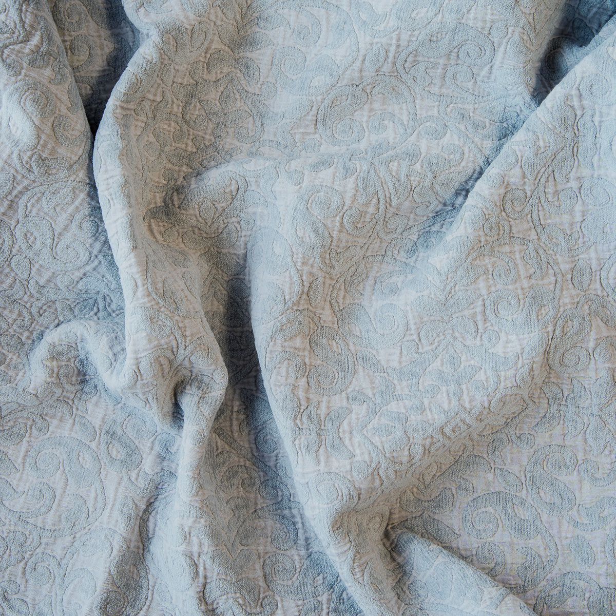 Cloud: A close up of Vienna cotton chenille jacquard in cloud, a soft, subtle sky blue-grey. 